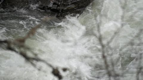 Water gushes down a river