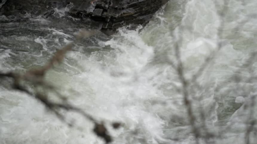 Water gushes down a river