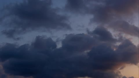 Clouds move through the sky
