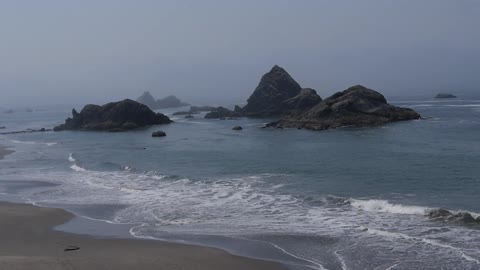 Rock outcroppings in ocean near beach