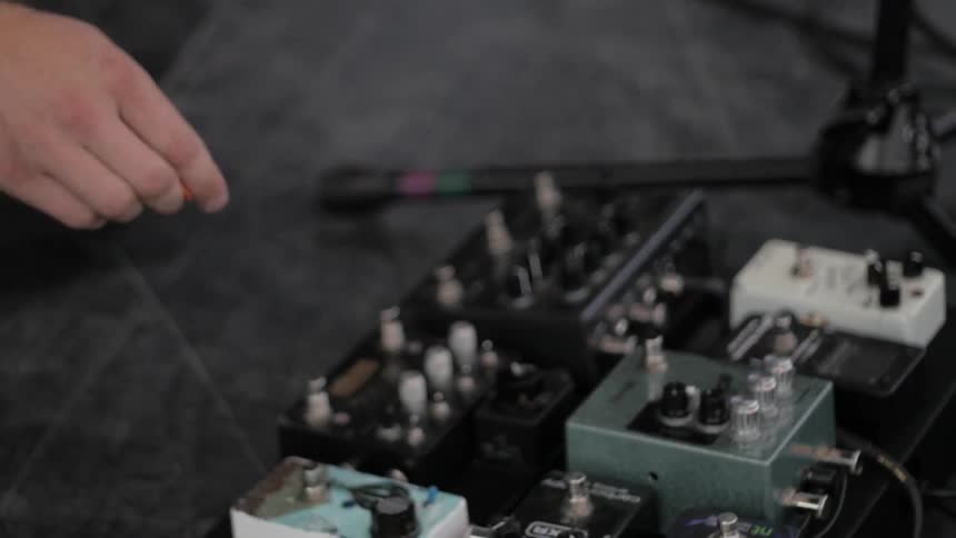 A man is playing with musical equipment