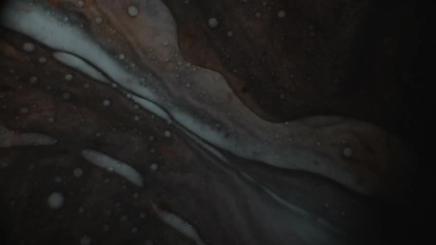 A microscopic view of a black liquid flowing