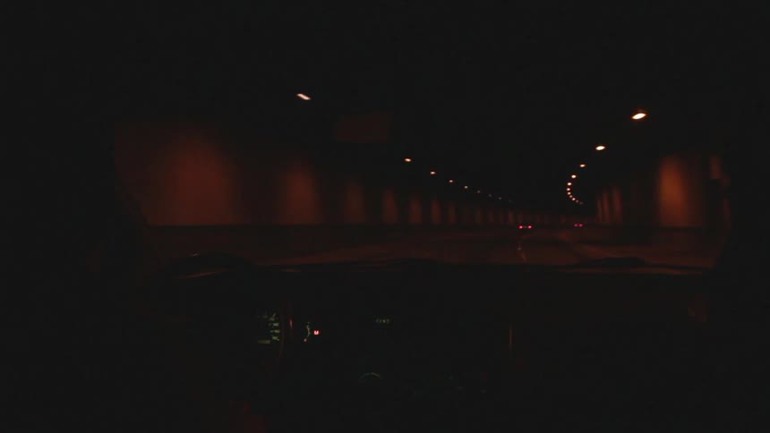 Car driving down a tunnel