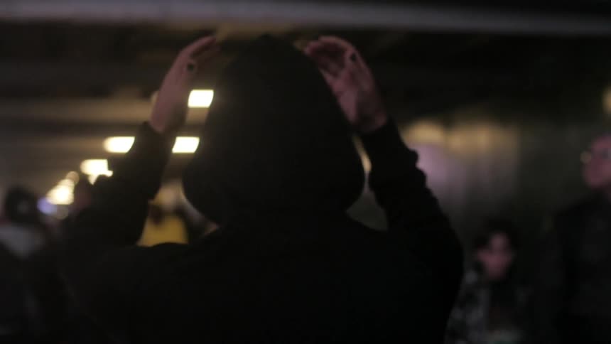 A woman walks in the city at night