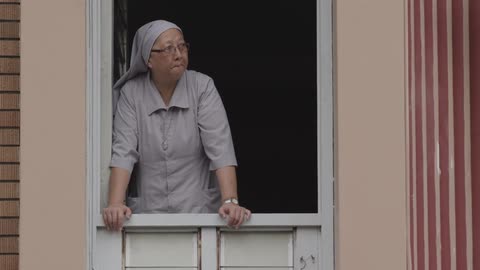 A woman looks into the sky