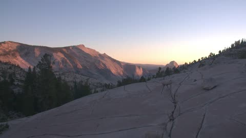 The sun shines on mountains