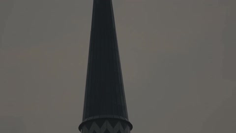 Tall steeple with blue and white chevron pattern
