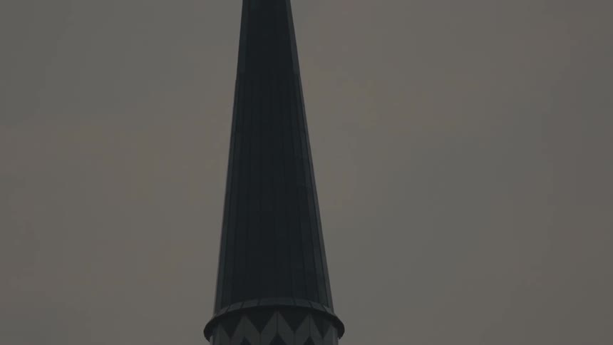 Tall steeple with blue and white chevron pattern
