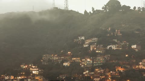 A town sits amongst the hills