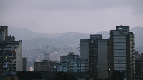 A storm rolls  into a city