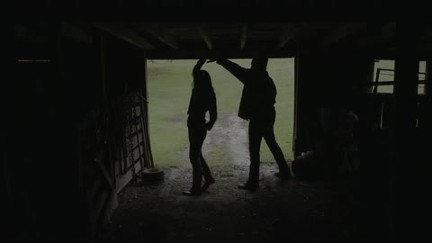 A couple is dancing in a bar
