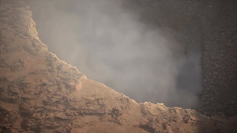 Smoke rises from the ground