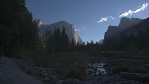 Mountains loom over a valley