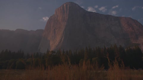 A mountain looms over a valley