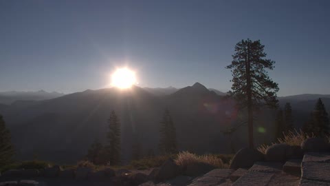 The sun shines over the mountains