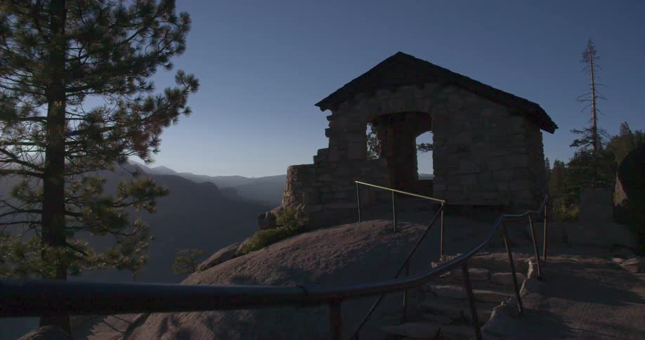 Steps lead to a small structure at the top of a canyon