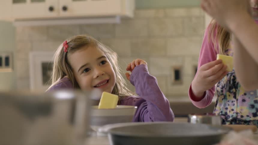 Kids helping cook in the kitchen