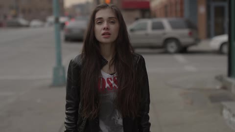 A person walking down a sidewalk