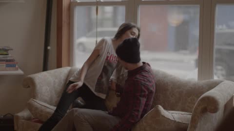 A man is smiling at a woman