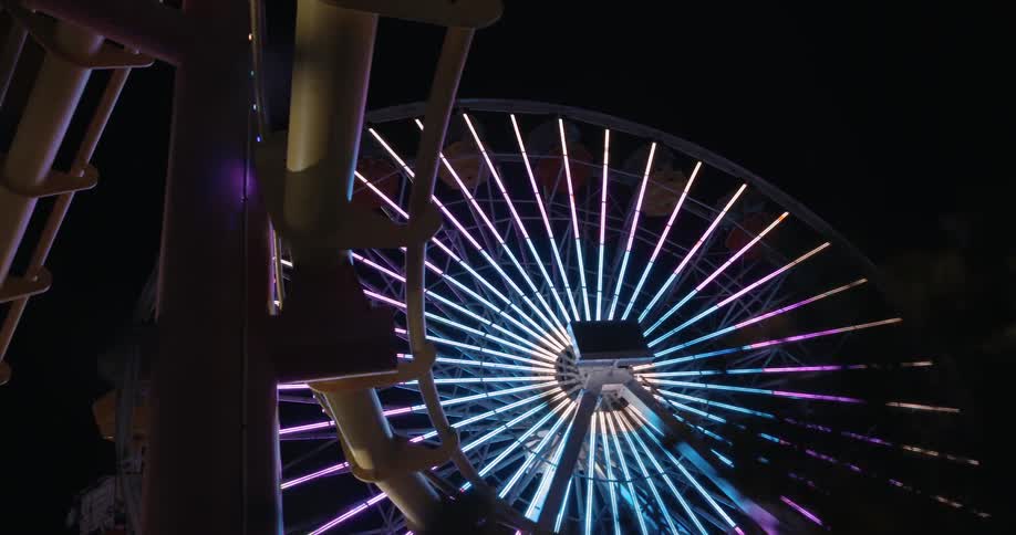 A lone carnival ride lights up at night