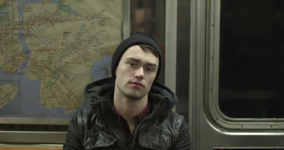 A man is falling asleep on the subway