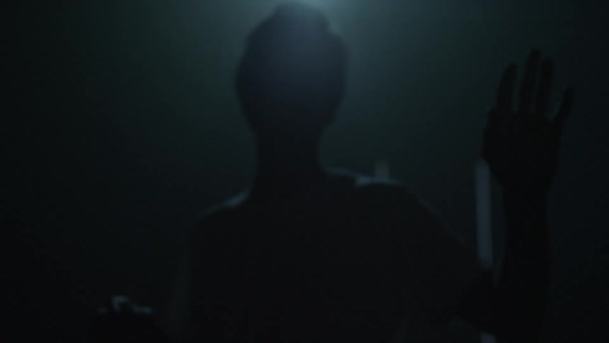 A man tries to understand where light patterns are coming from