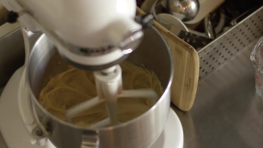 A stand mixer stirs ingredients