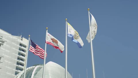 Four flags blow in the wind