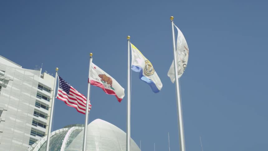 Four flags blow in the wind