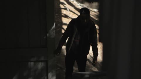 A man walks up a set of outdoor stairs