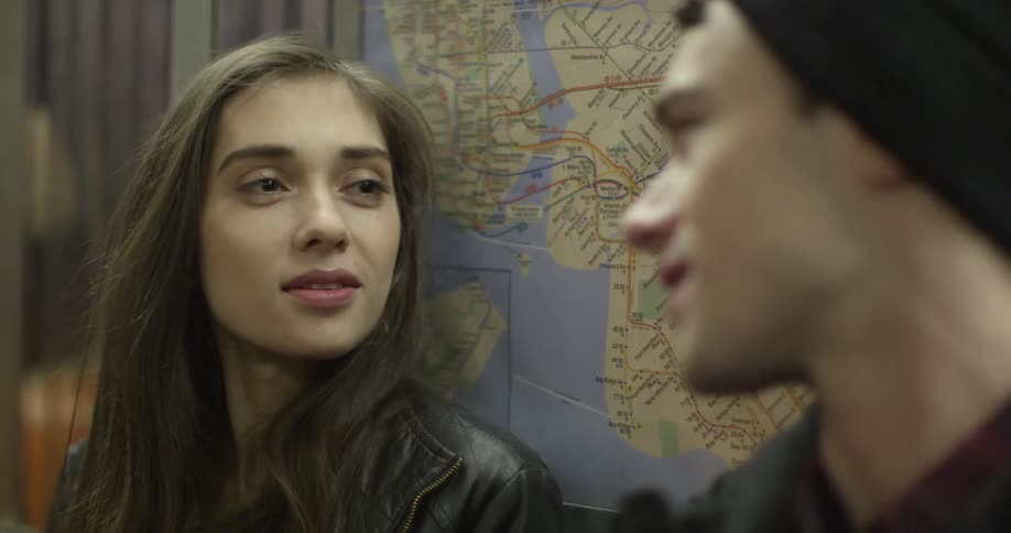 A woman sits next to a man