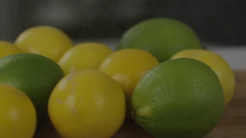 A mist falls on limes and lemons