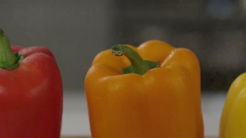 Bell peppers are sprayed with mist